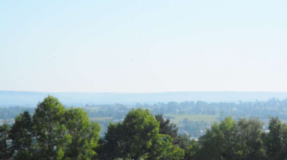 View from the bathroom window in Vire, France. Somewhere out in the distance is Caen.